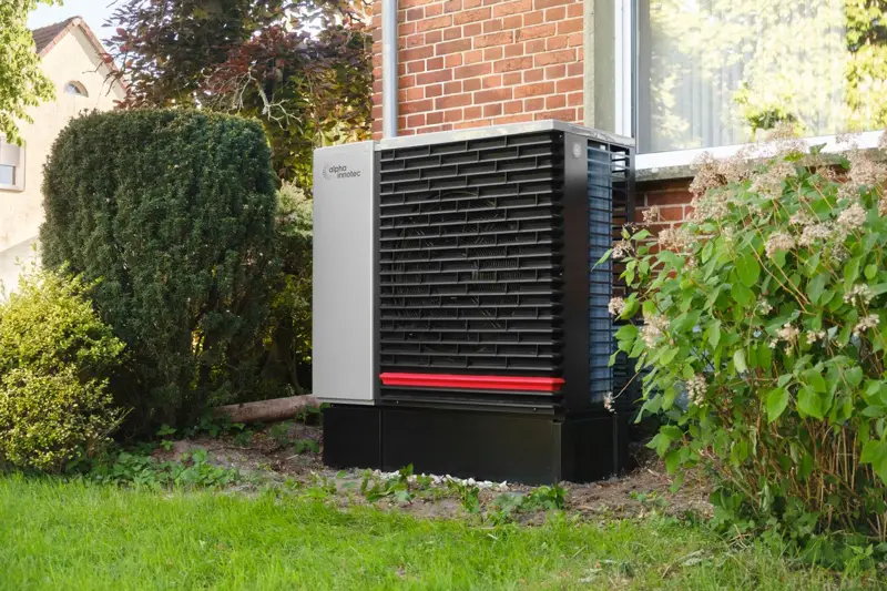 Modern heat pump outside a home